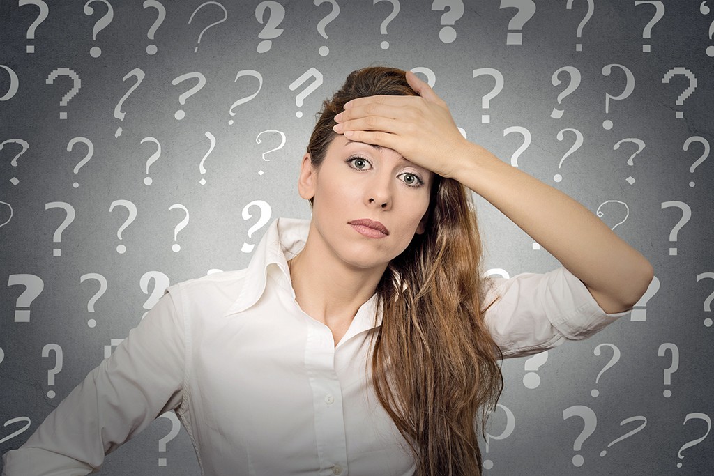 questions to ask a financial advisor with woman's hand on her head picture